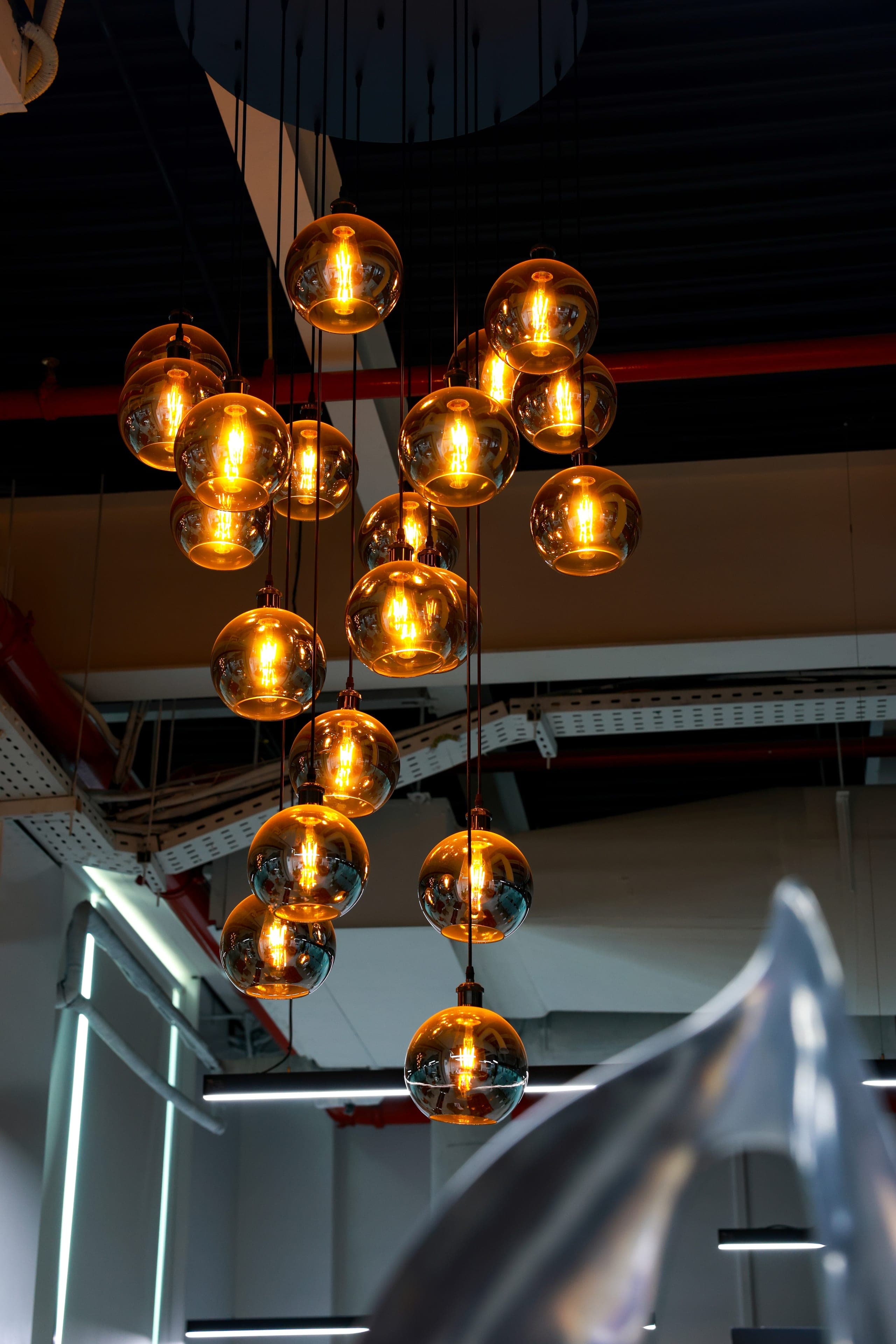 Clustered glass pendants over the lounge