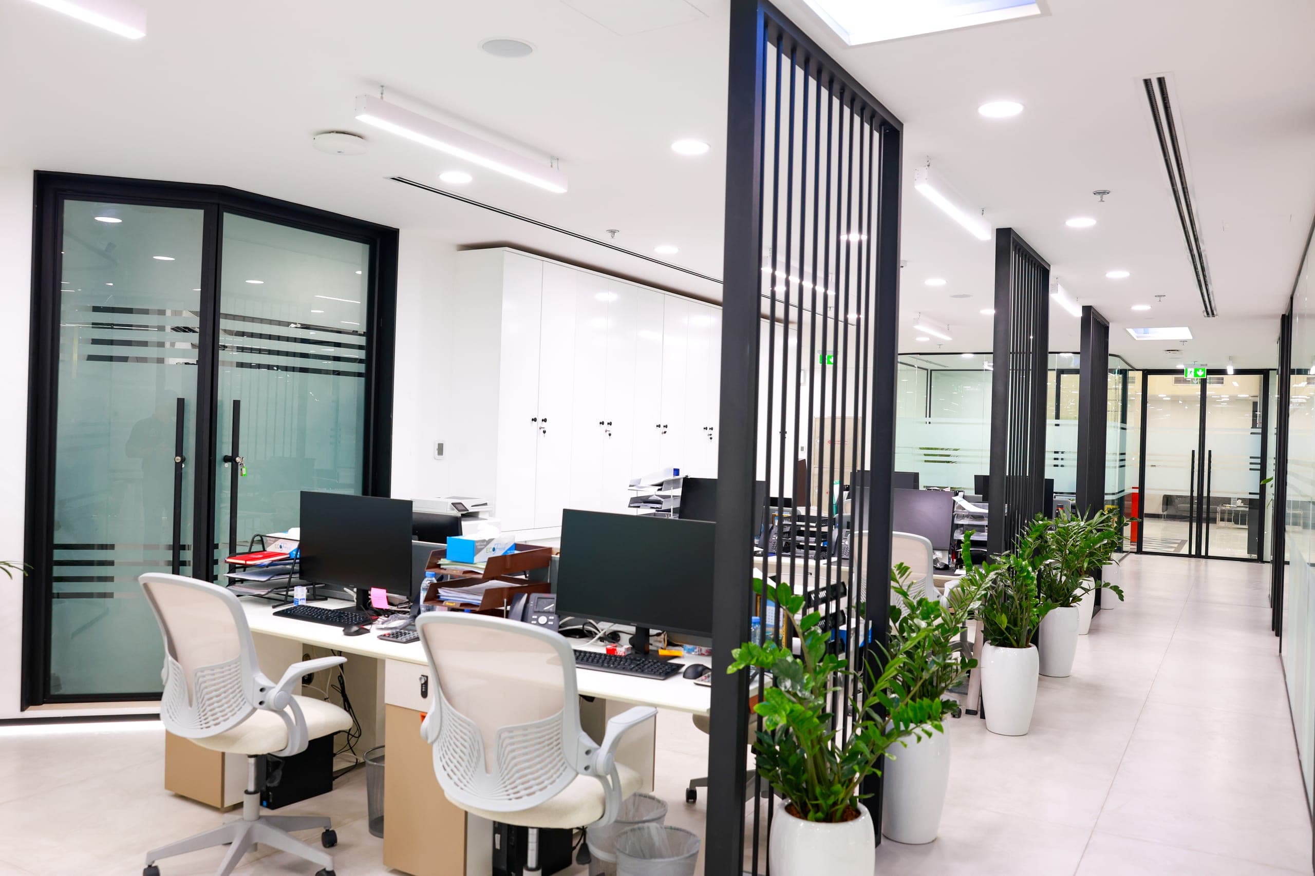 Black-framed glazing enclosing a desking bay