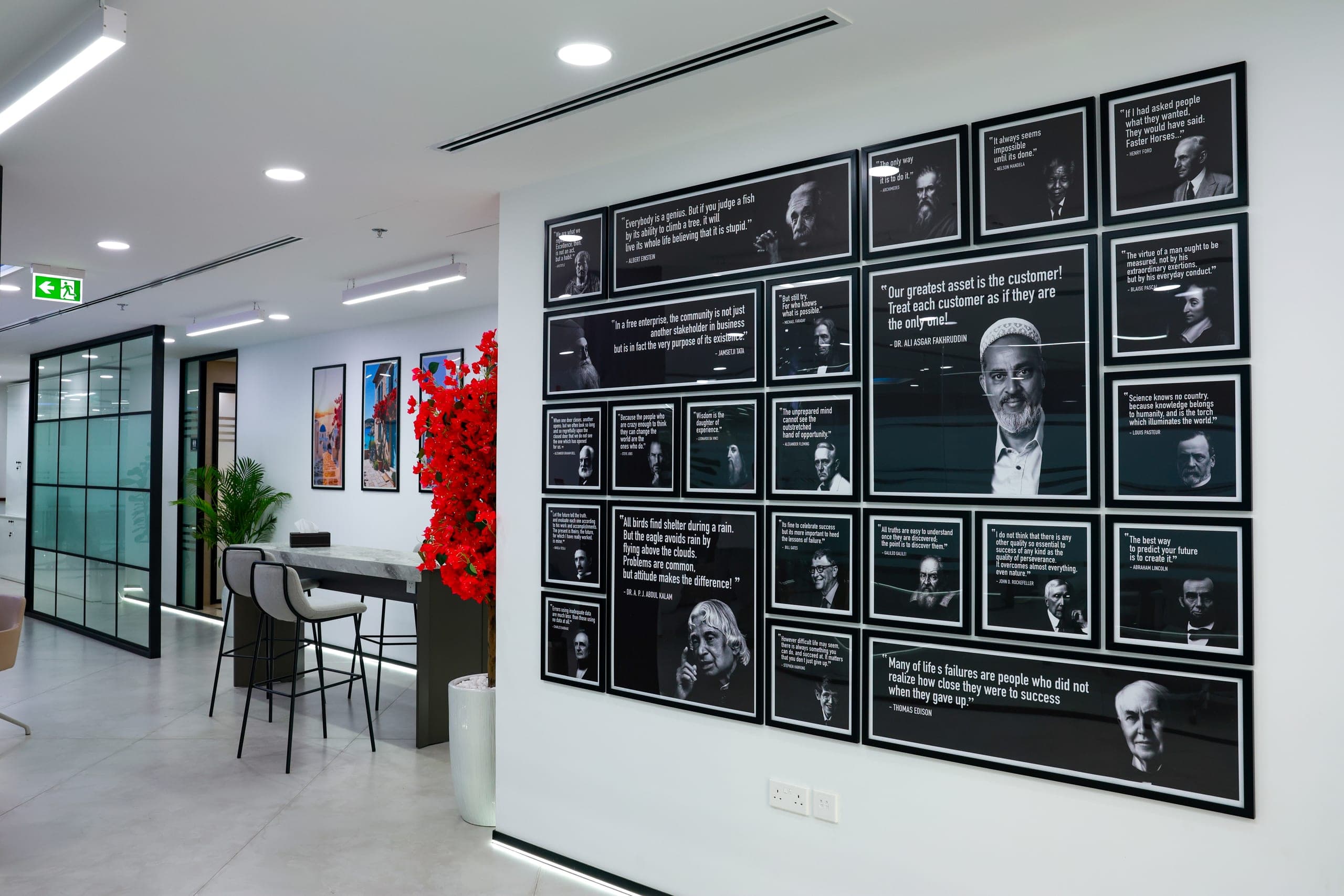 A printed feature wall beside a high table