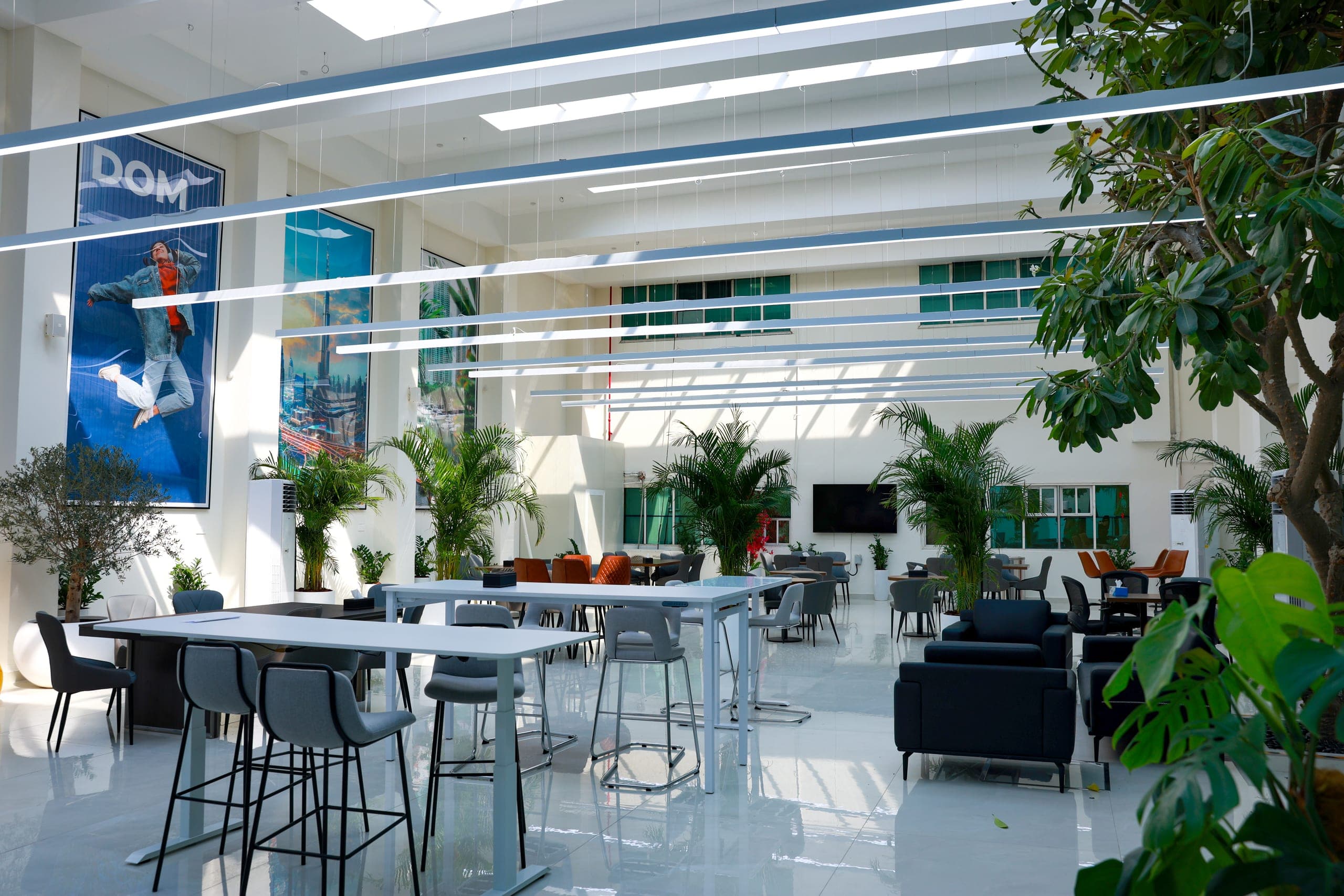 High tables and stools along the glazed perimeter
