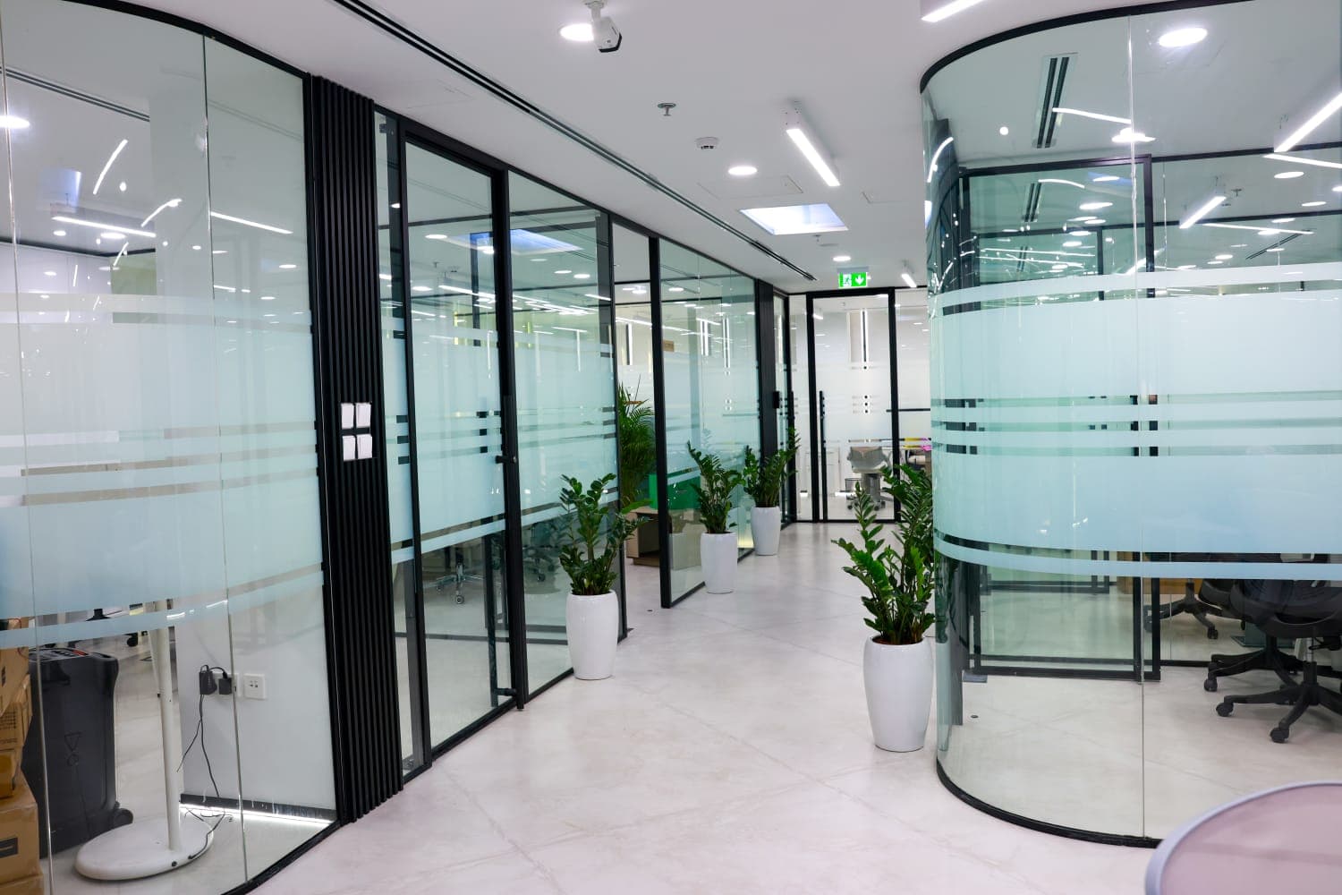Clear and frosted glazing meeting at a framed junction