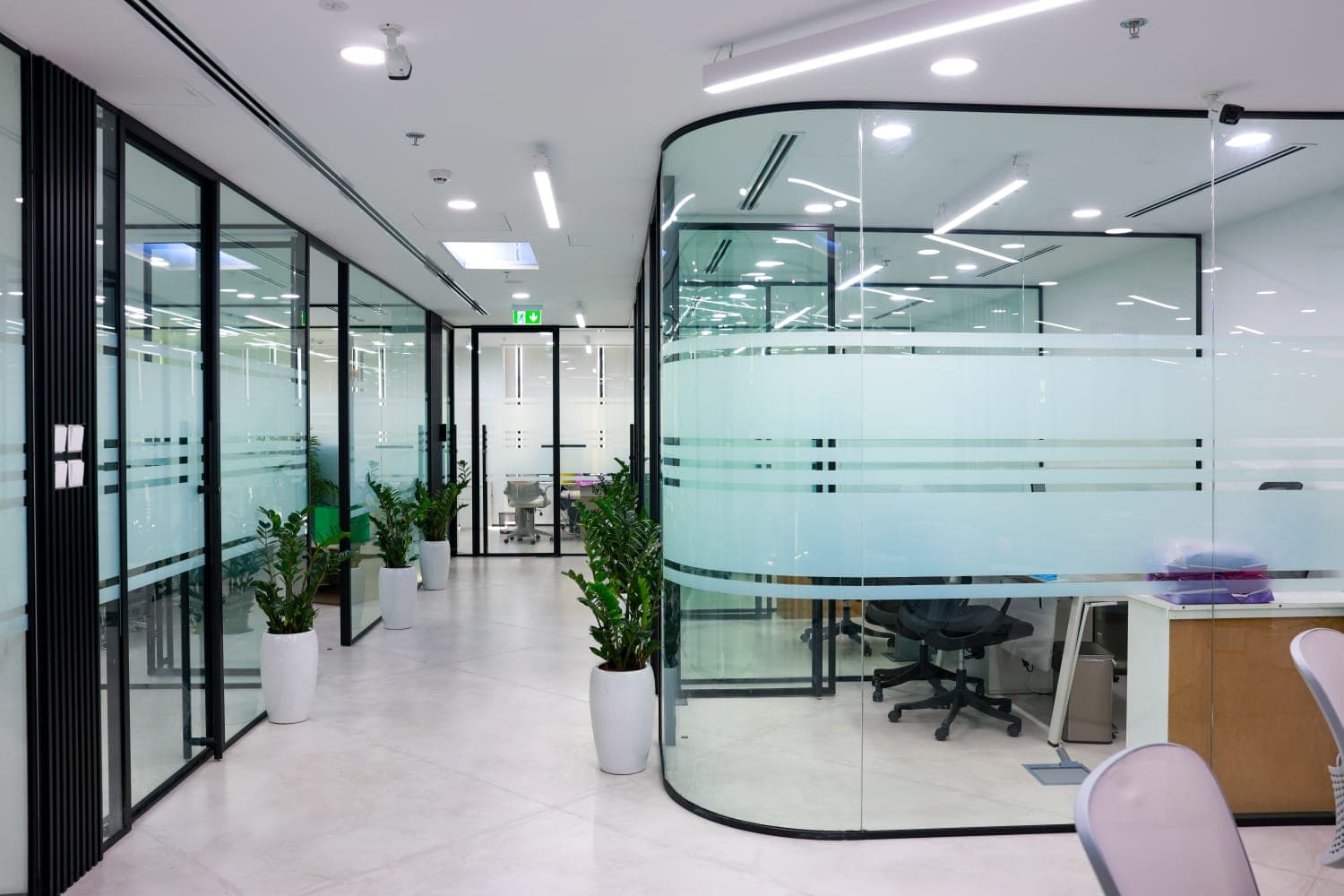 A glazed door set into a partition run