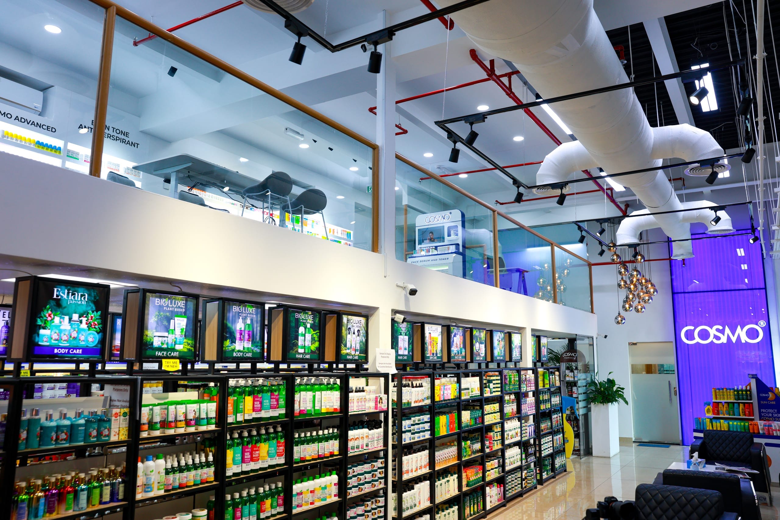 Retail shelving and signage under exposed services in a cosmetics store