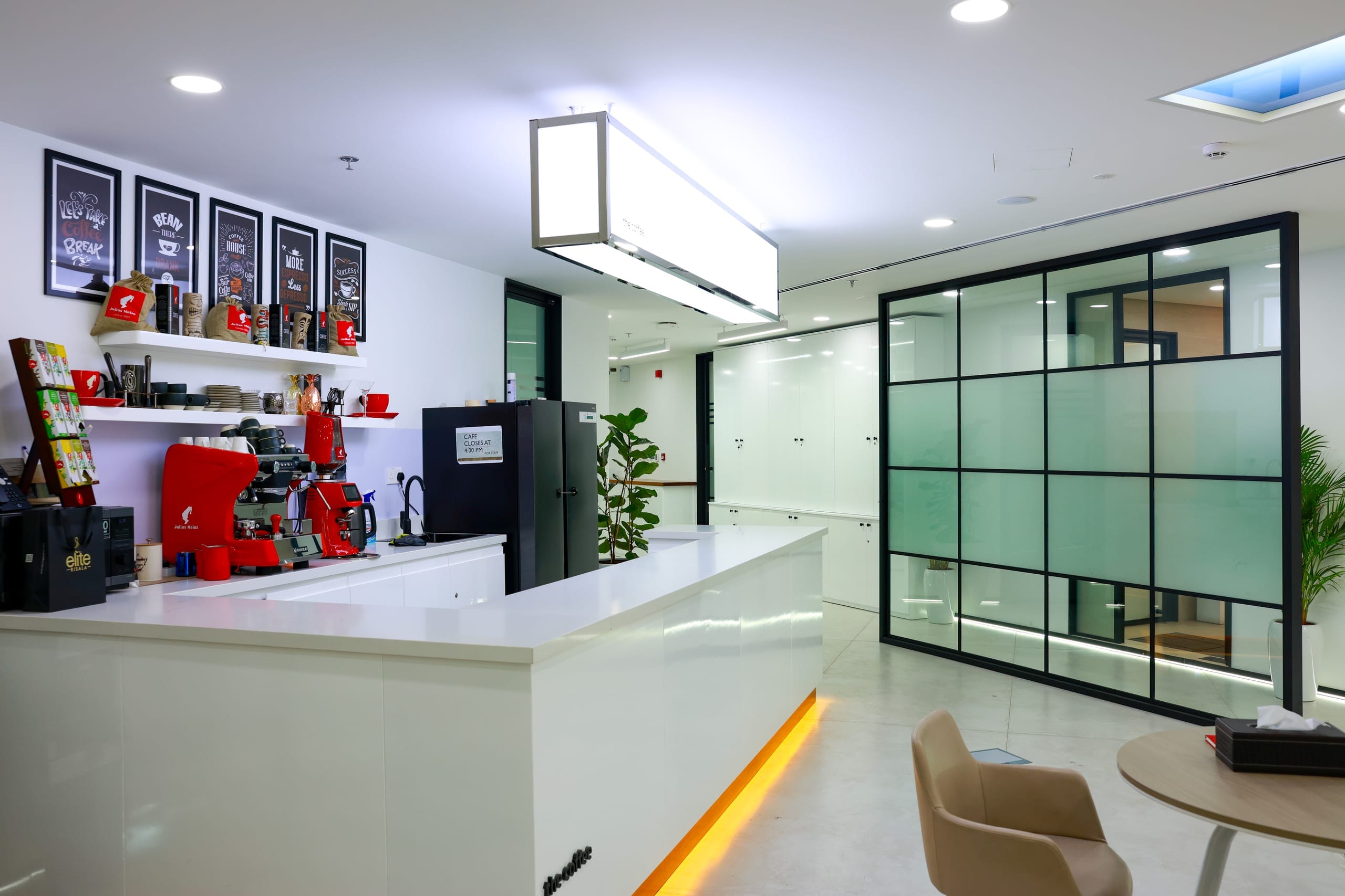 An office reception counter with concealed cove lighting