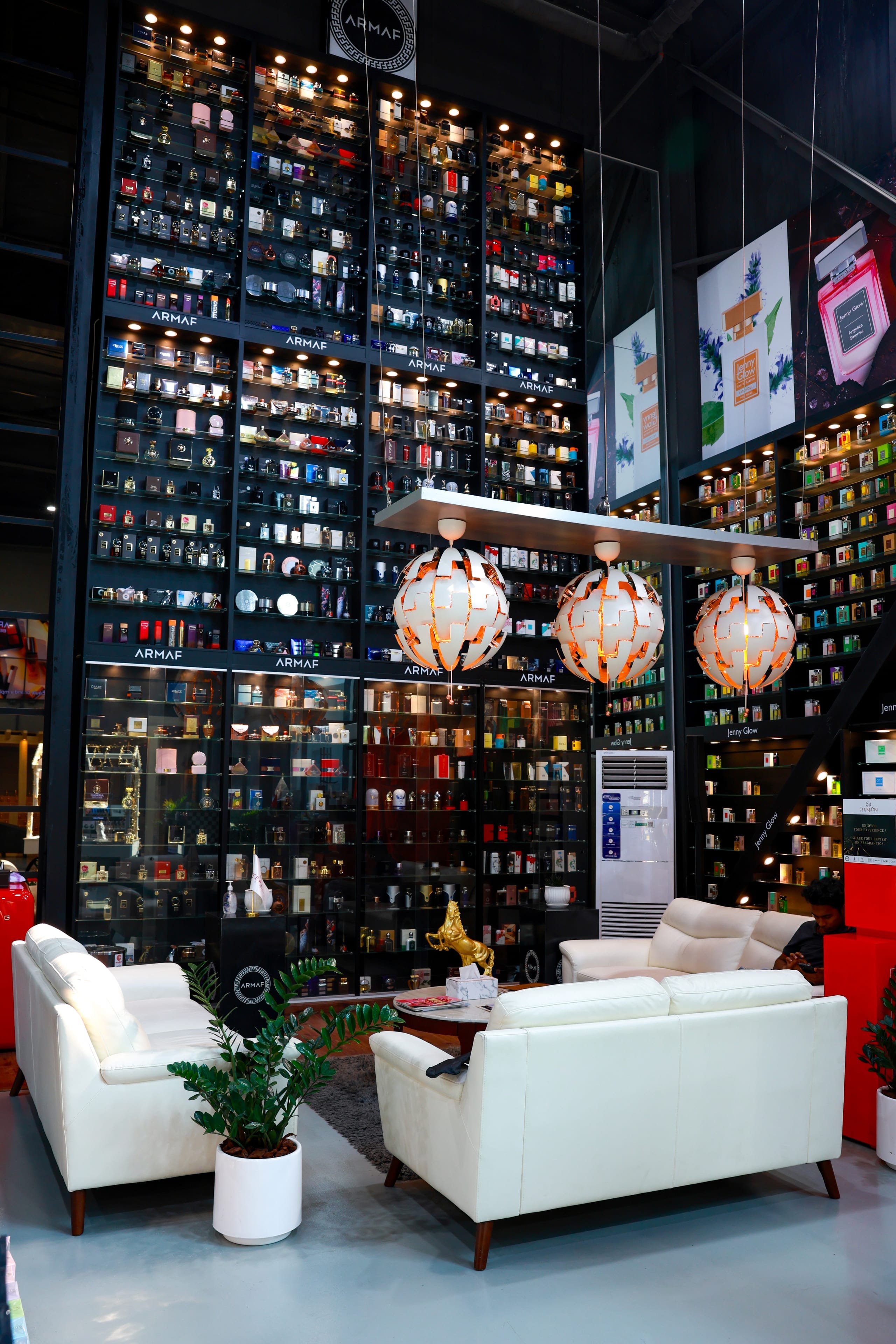 Seating set against floor-to-ceiling black display shelving